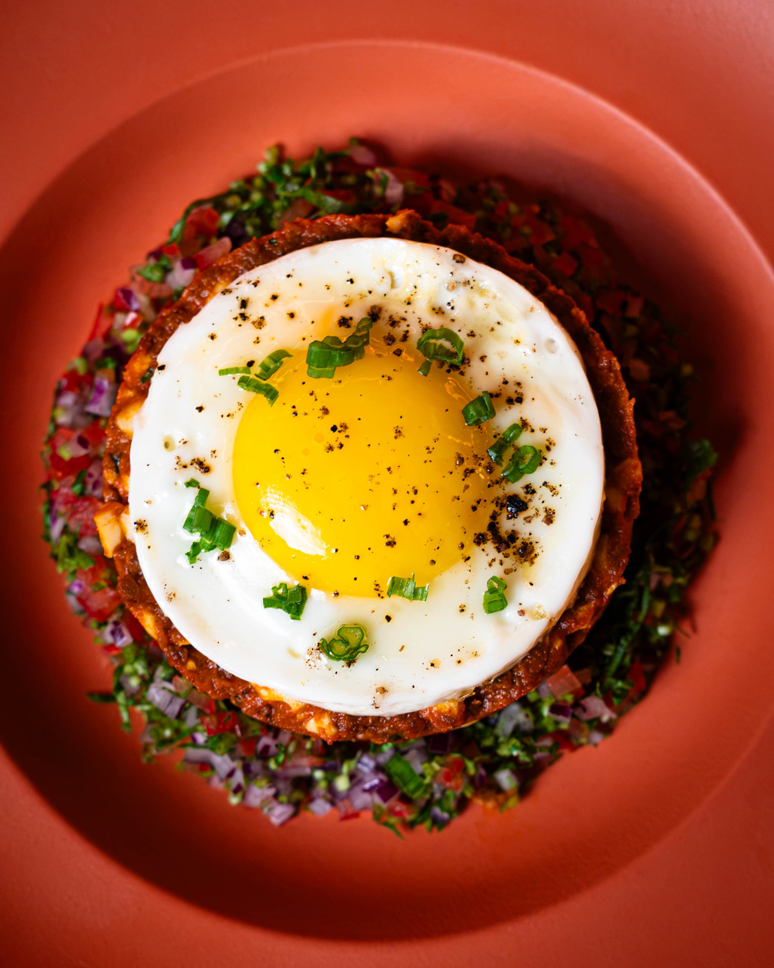 Signature dish with a fried egg, photographed overhead